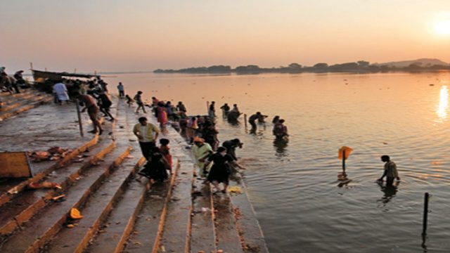 Devotees taking a dip in the River Godavari in Basar