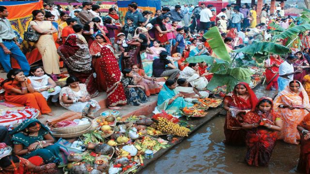 Devotees offer prayers and fruits to the sun god in Patna