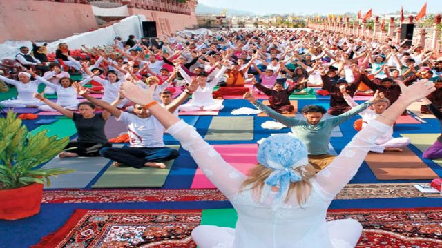 A morning asana class at yoga ghat by the River Ganga
