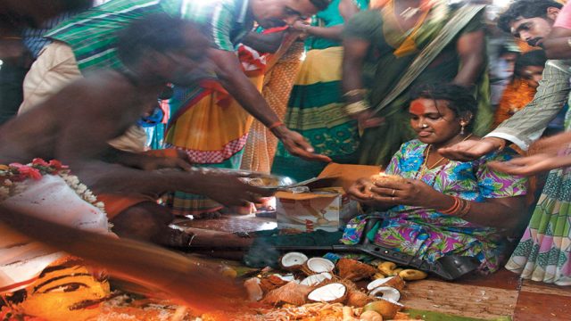 A priest performs the rituals to join a hijra and the temple deity in marriage