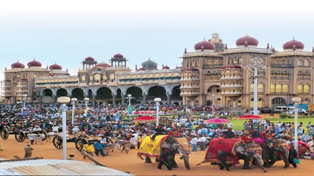 A grand procession in front of the splendid Mysore Palace