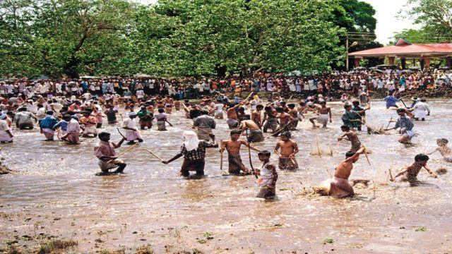 A waterlogged paddy field plays host to mock battles