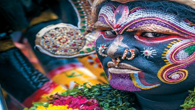A devotee dressed as Mahakali during the festival of Bonalu