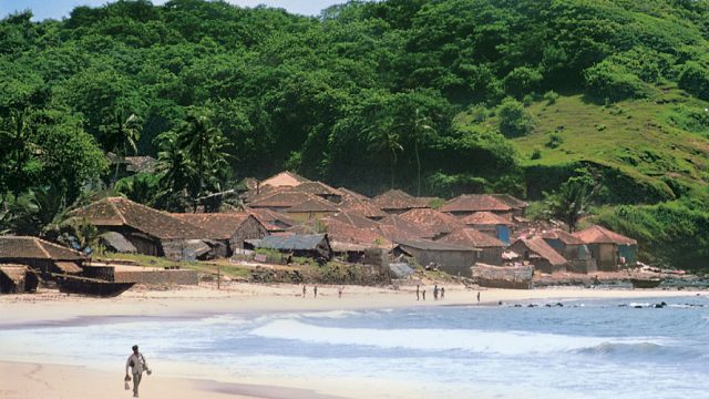 Hedavi Village, flanked by verdant hills and a pristine beach