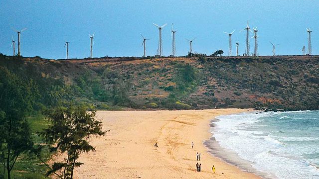 Devgad Beach, flanked by windmills at one end