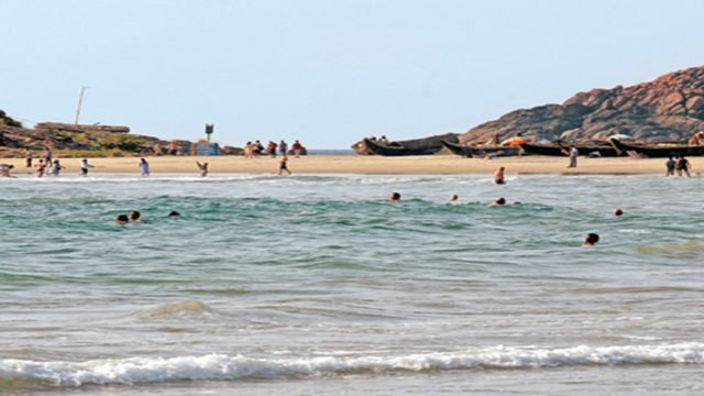 Visitors enjoying a clear day at Hawa Beach