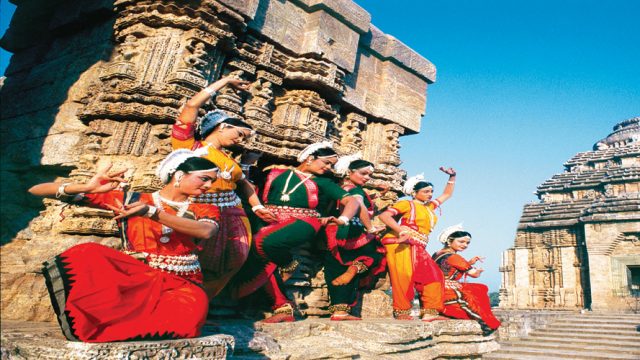 Classical dancers strike a pose at the Konark Sun Temple