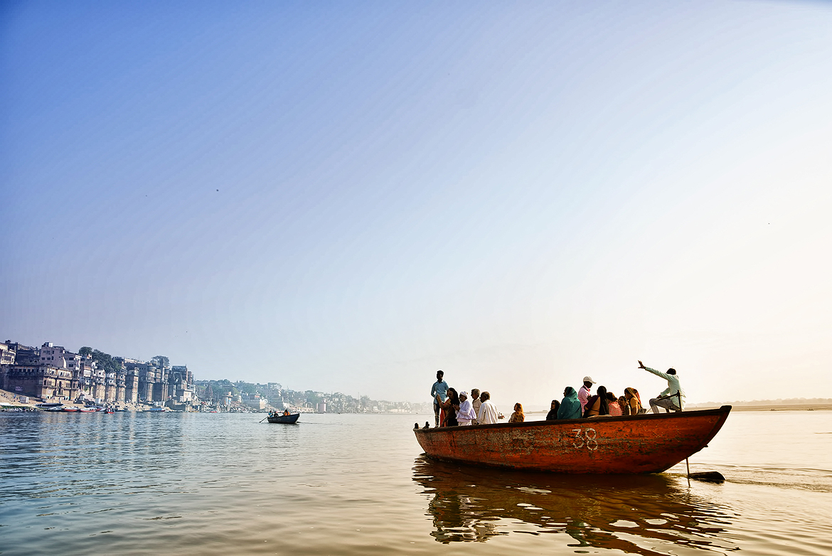 On an early morning boat ride on the Ganga, a tour guide spins tall tales about the city