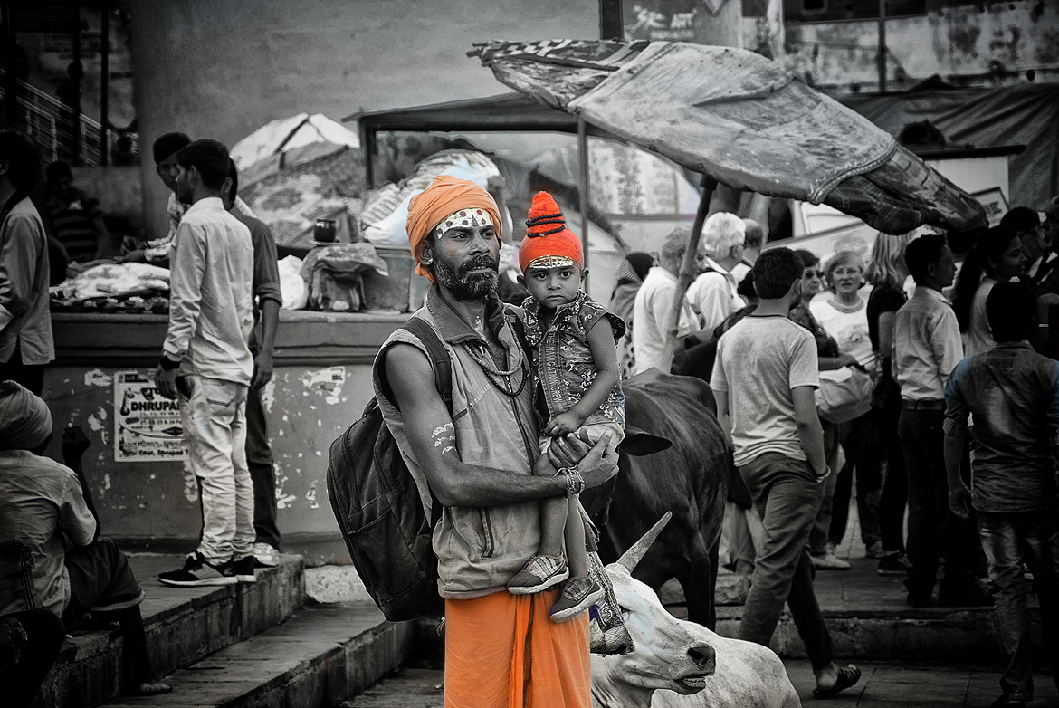 Father and son check out the scene on the ghats