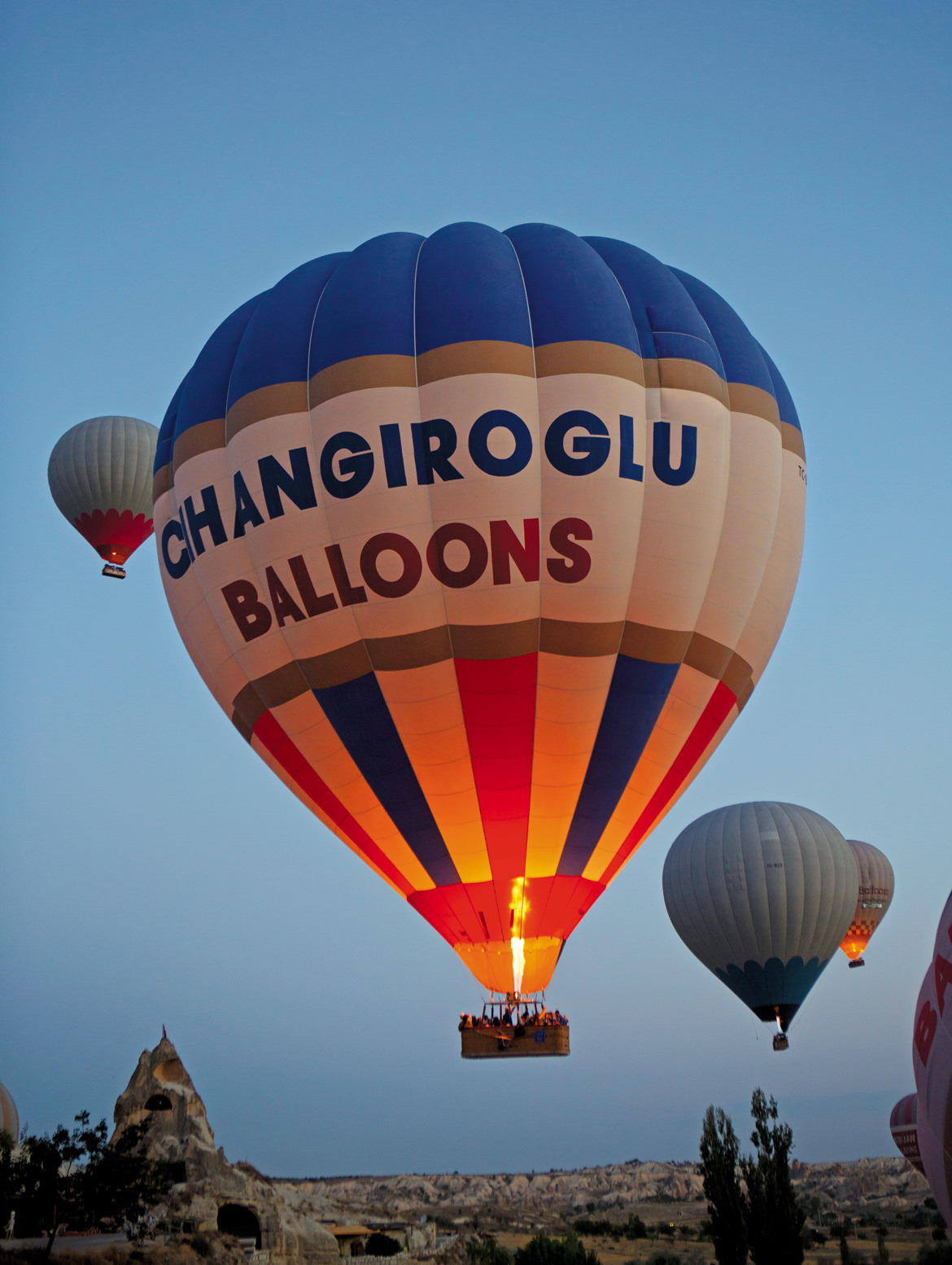 Finally warmed up, hot air balloons take flight