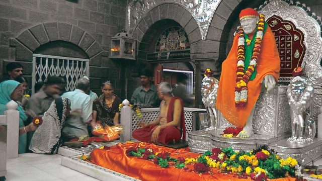 Devotees paying their respects in the Sai Baba Temple