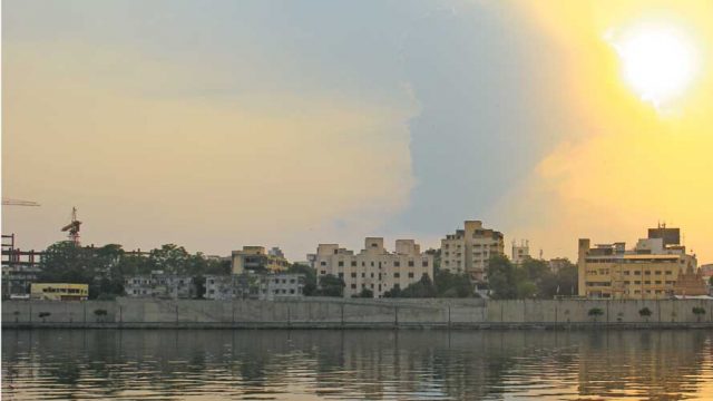 The Sabarmati river, tinged with gold in the light of the rising sun