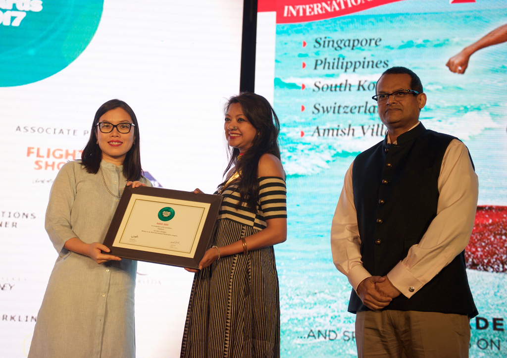 Yuemin Li - Misra, Area Director, North & East India; Bangladesh, receives the Readers’ Choice award for Best International Destination (overall) for Singapore