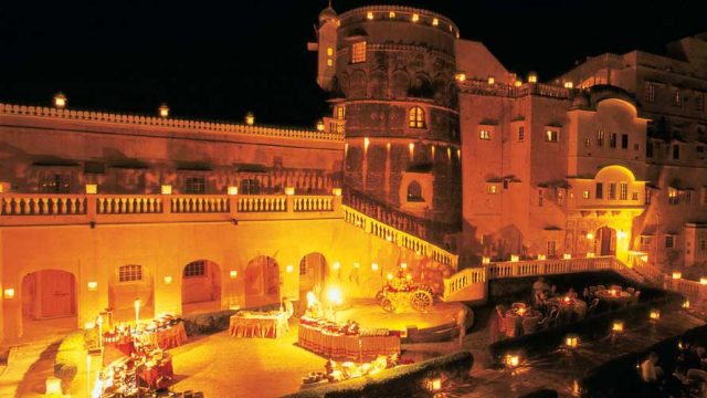 Brilliant lights set Castle Mandawa aglow at night