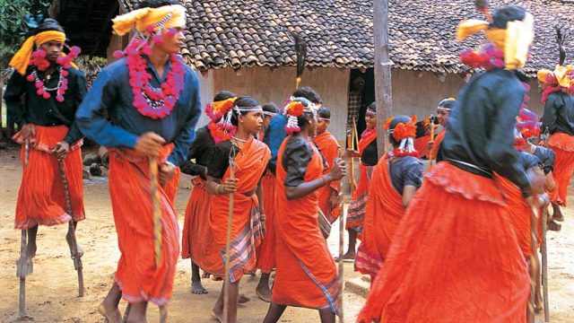 Members of the Maria tribe performing a dance in their village