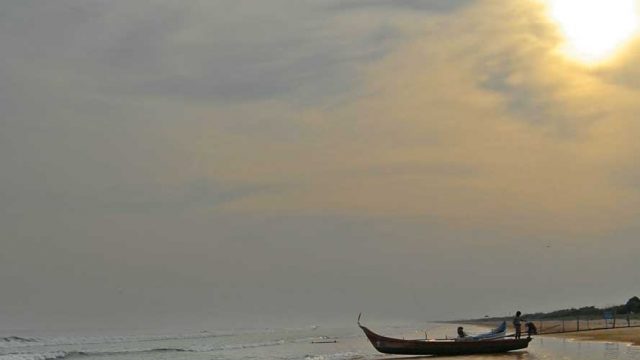 Waters at Suryalanka Beach, reflecting the colours of the rising sun