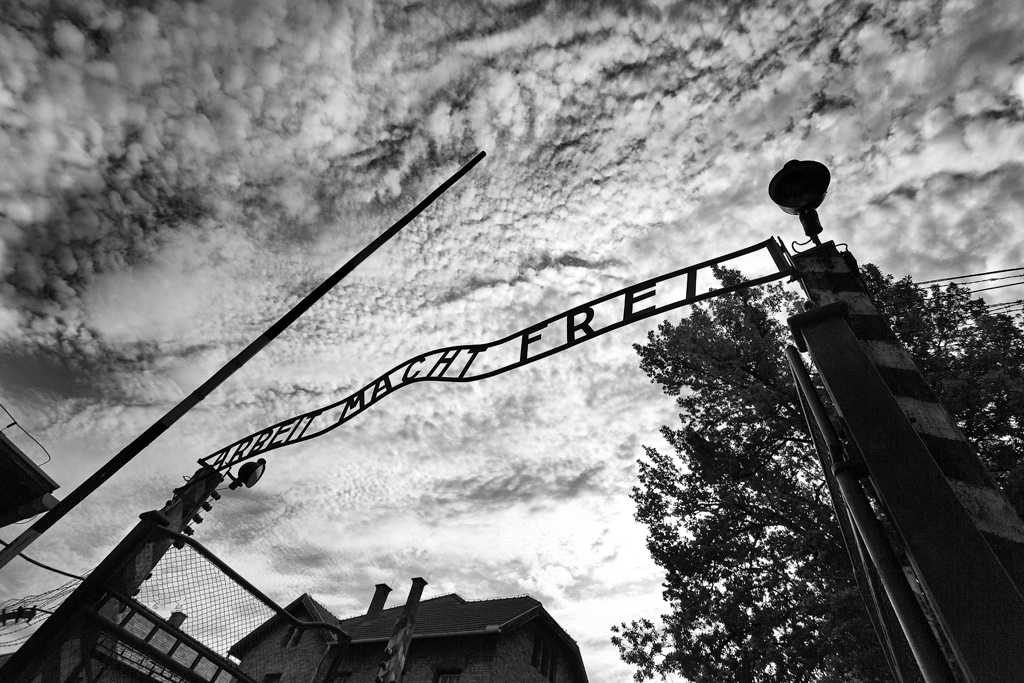 The entrance arch at the Auschwitz concentration camp, Poland. Like some other Nazi concentration camps, it bears the infamous words, “Arbeit Macht Frei” (work sets you free).