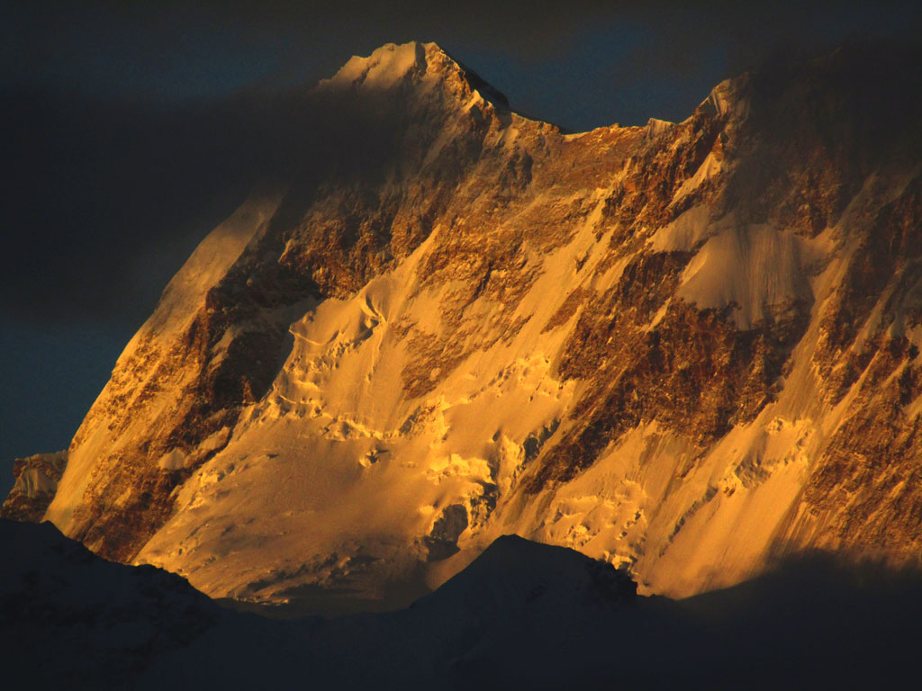 The giant east face of the 7,893m Himalchuli catches fire at dawn