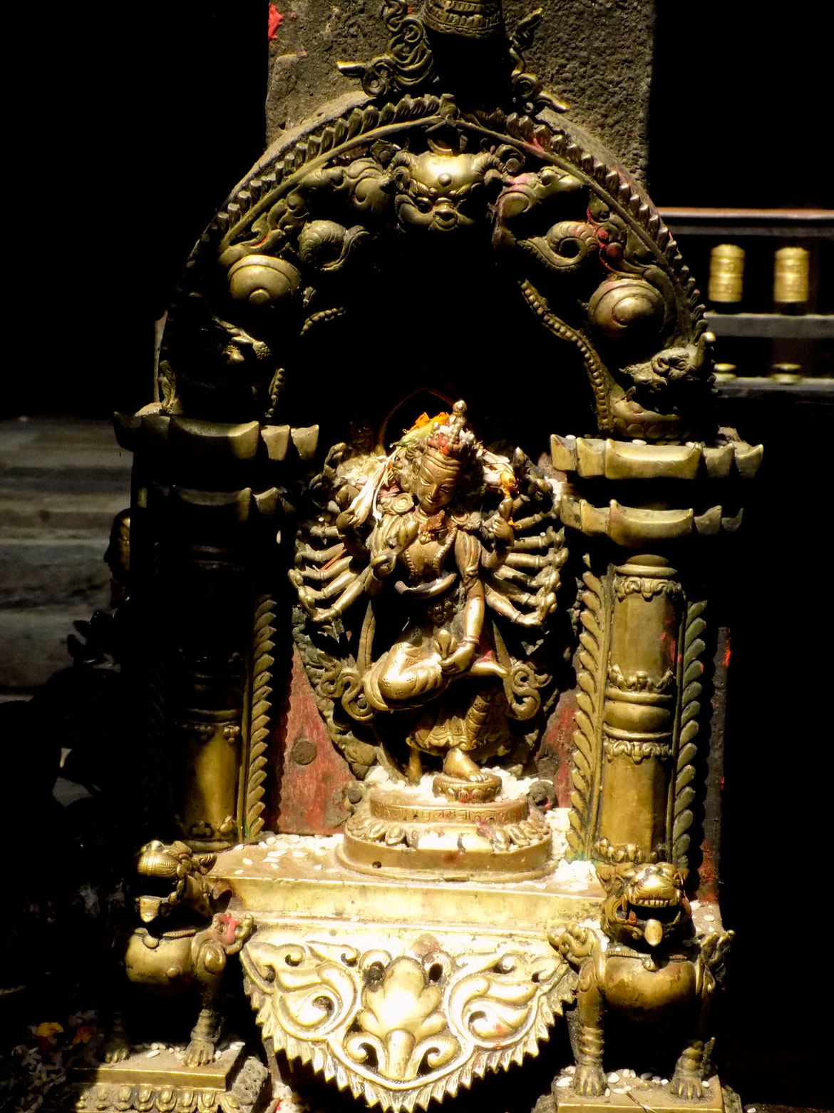 At the Kwa Baha, you will find depictions of 12 forms of the Bodhisattva Avalokiteshwara, including this one, Nrityeshwar. Avalokiteshwara is the most important deity of Patan, and maybe even the entire Kathmandu Valley. The cult of Karunamaya or Rakta Lokeshwara is the basis of the biggest religious festival of Patan, the Karunamaya Rath Yatra. Hindus identify Karunamaya with the Saiva siddha Macchendranath