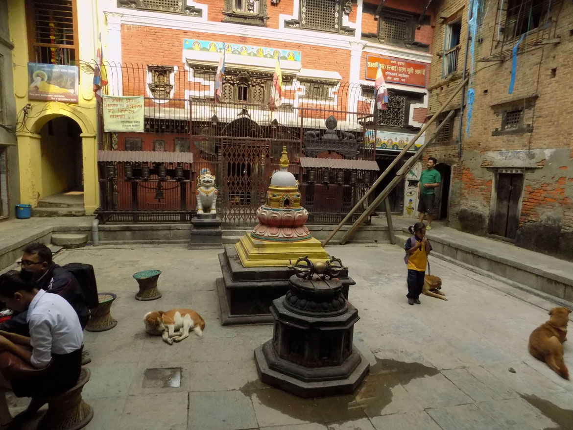 A stone's throw away from the Durbar Square are the Buddhist courtyards of the Mangah neighbourhood. Most of them have a common space surrounded by houses. The courtyards are secular spaces, but they also function as the immediate sacred site for the people of the neighbourhood, so you will find stupas, three-dimensional mandalas and the sacred vajra, along with a shrine to the Buddha in even the most basic courtyard.