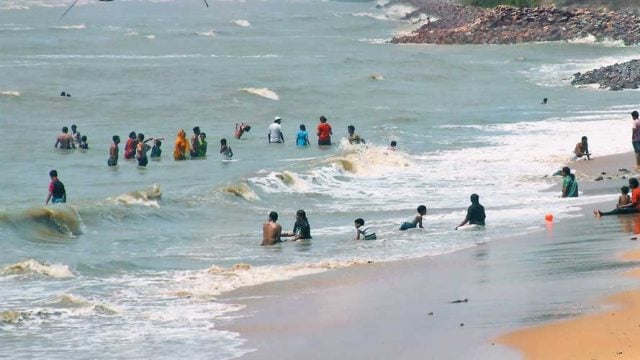 Revellers at Chandipur making the most of the tide when it is in