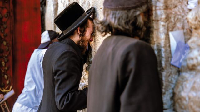 A Jew grieves the loss of his temple, Western Wall, Jerusalem, Israel. Western Wall is what remains of the holiest site of the Jews.