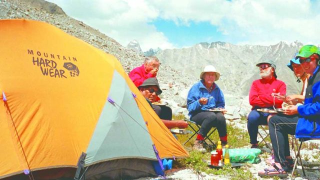 Trekkers enjoying a simple lunch at their campsite