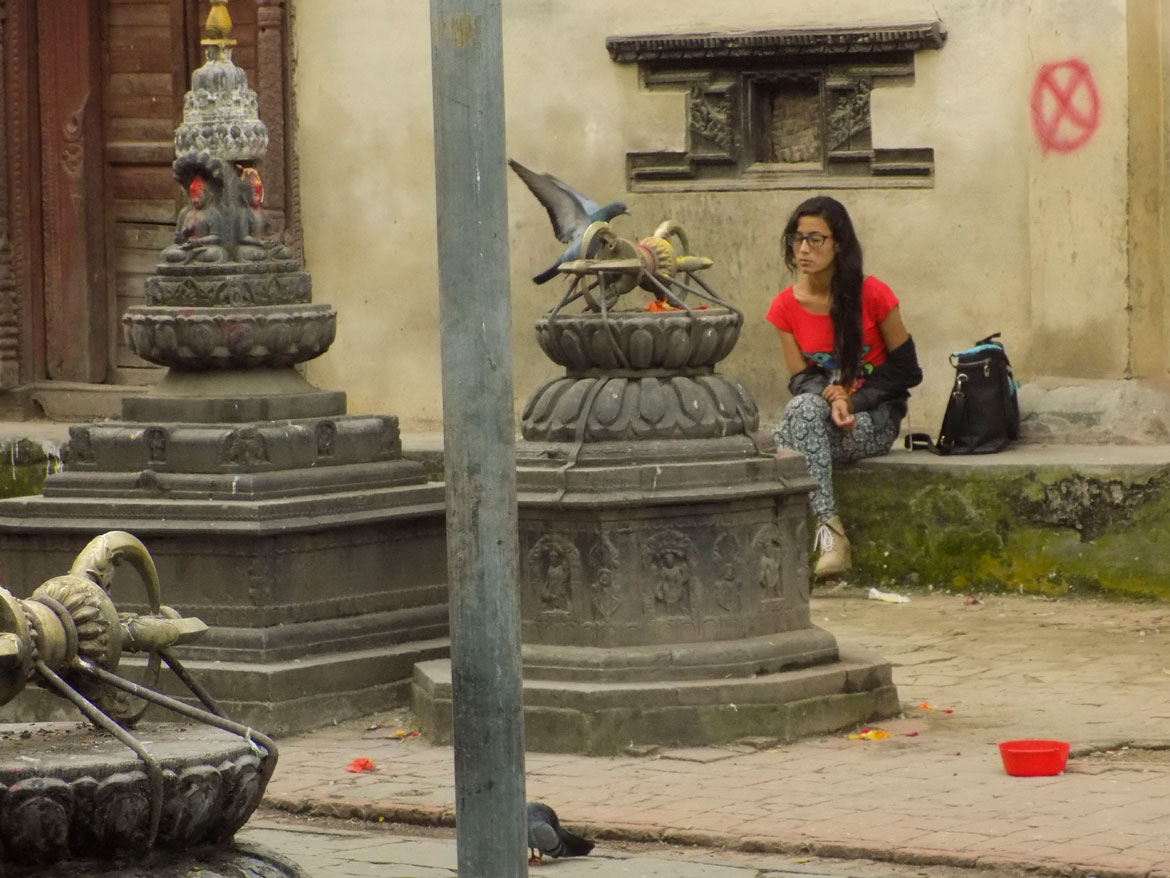 A girl drops in for a quick prayer at the Tanga Baha or the Jyeshthavarna Mahavihar near the Mangah market. Another old monastic courtyard, this is a popular meeting spot for local Newars