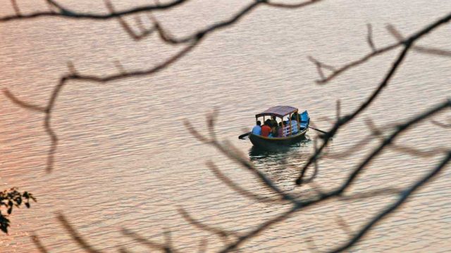 Visitors enjoying a boat ride on Muradih Lake