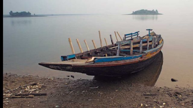 Rowboat by the serene lake of Kangsabati dam, Mukutmanipur