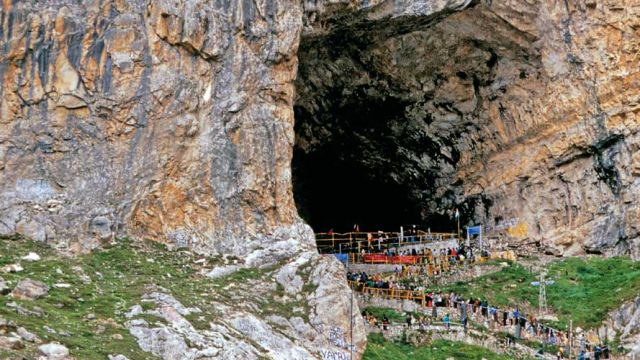 Devotees entering the mouth of the massive Amarnath cave