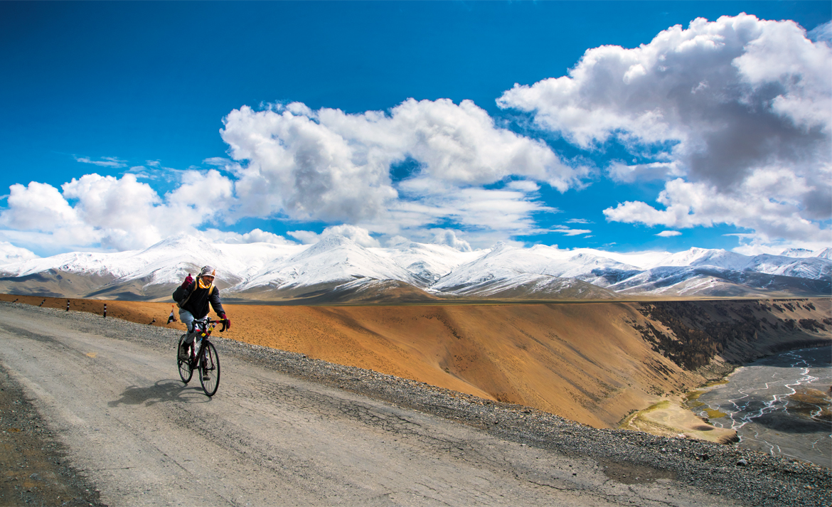 A mountain biker cruises along at More plains