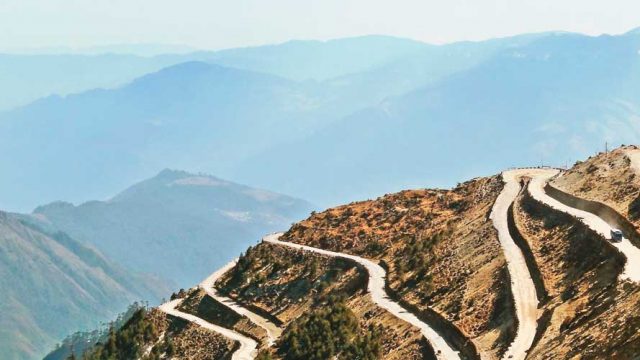 The circuitous mountain road leading up to Sela Pass