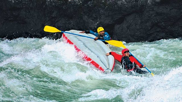 Kayakers navigate the rapids