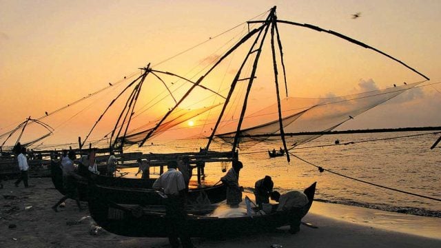 Fishermen hauling in their large Chinese fishing nets at Kochi