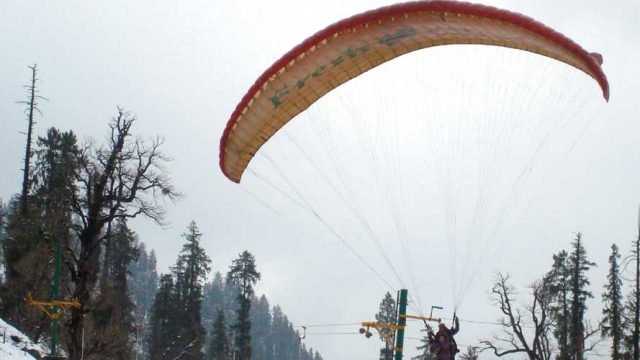 Paraglide across Manali in winter