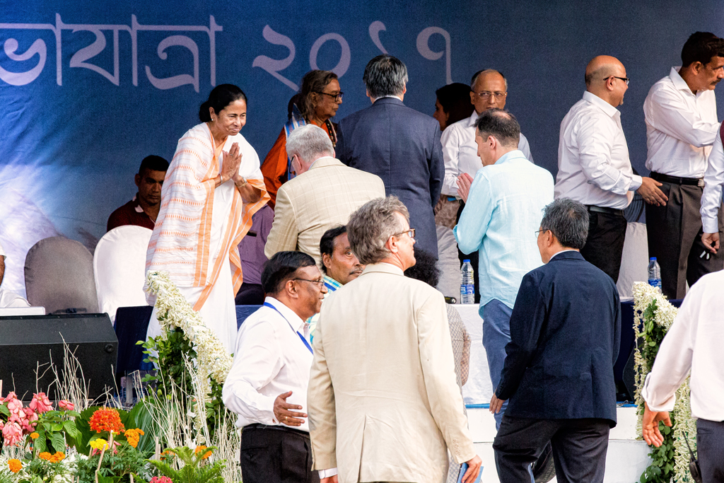 CM Mamata Banerjee greets dignitaries before the start of the immersion carnival