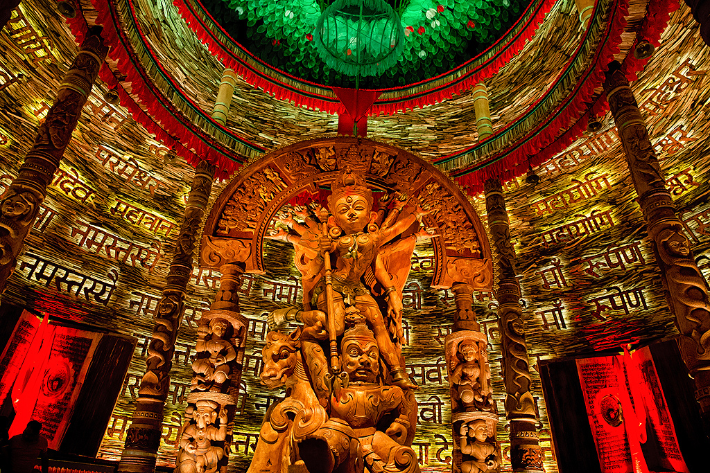 The pandal at Chetla Agrani resembles a Shiv Lingam from the outside and inside, different types of wood have been used to create the fantastic theme