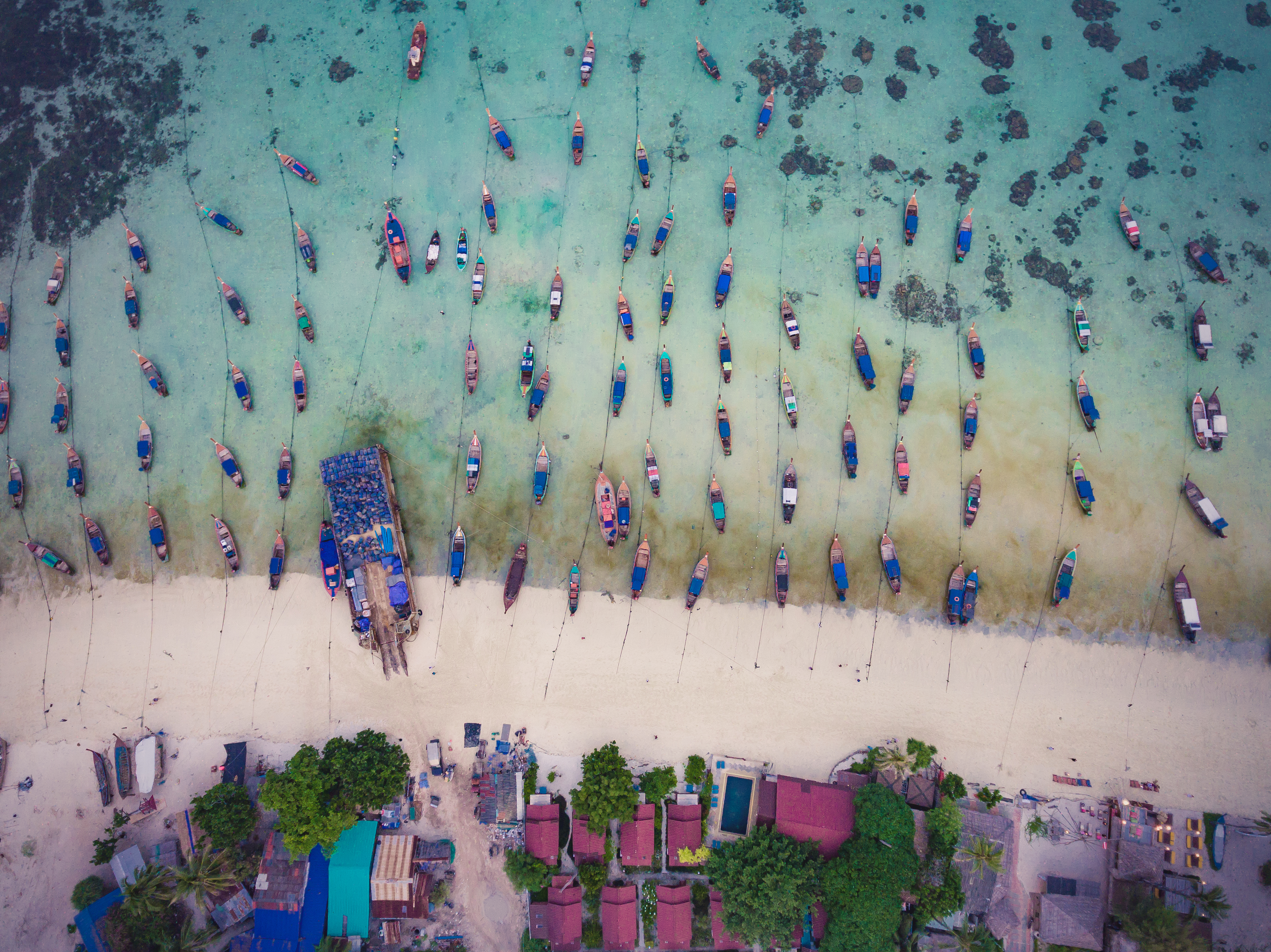 Koh Lipe island in Satun, Thailand studded with long-tailed boats