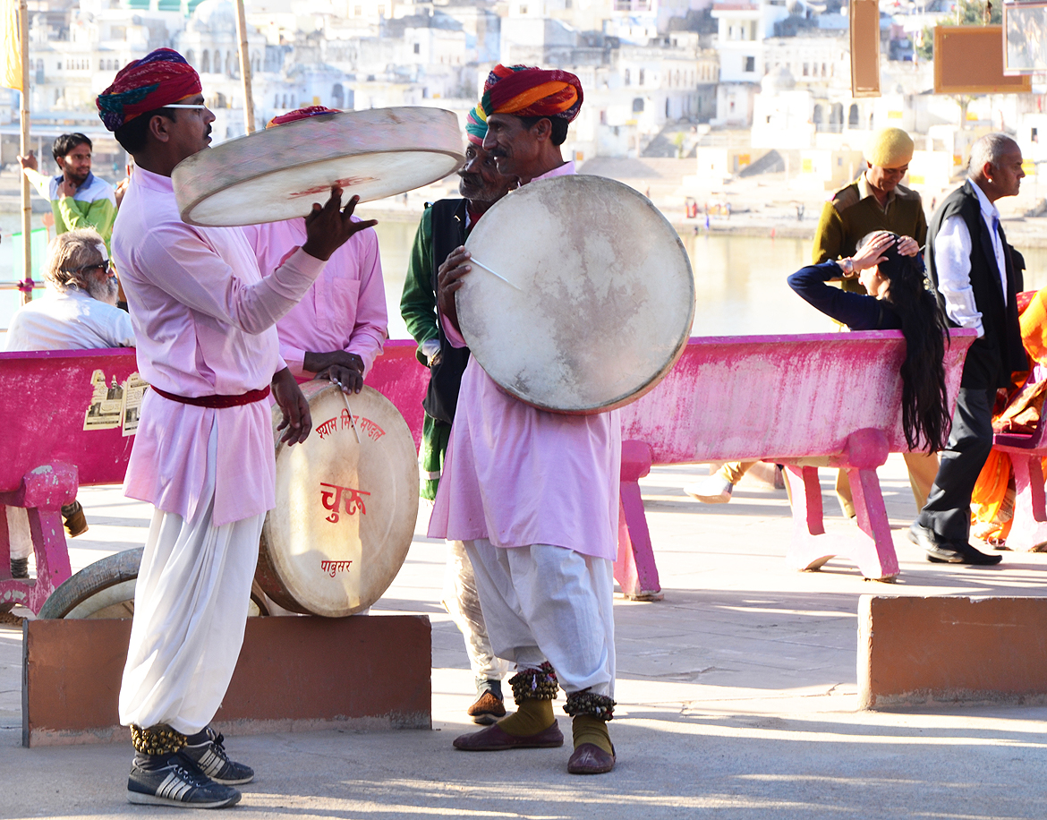 Traditional performers warm up before they join the guided heritage walk around the lake.