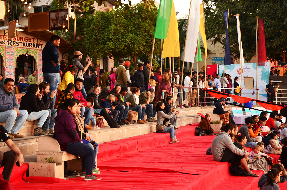 The crowd waits patiently as the performers get ready for the event.