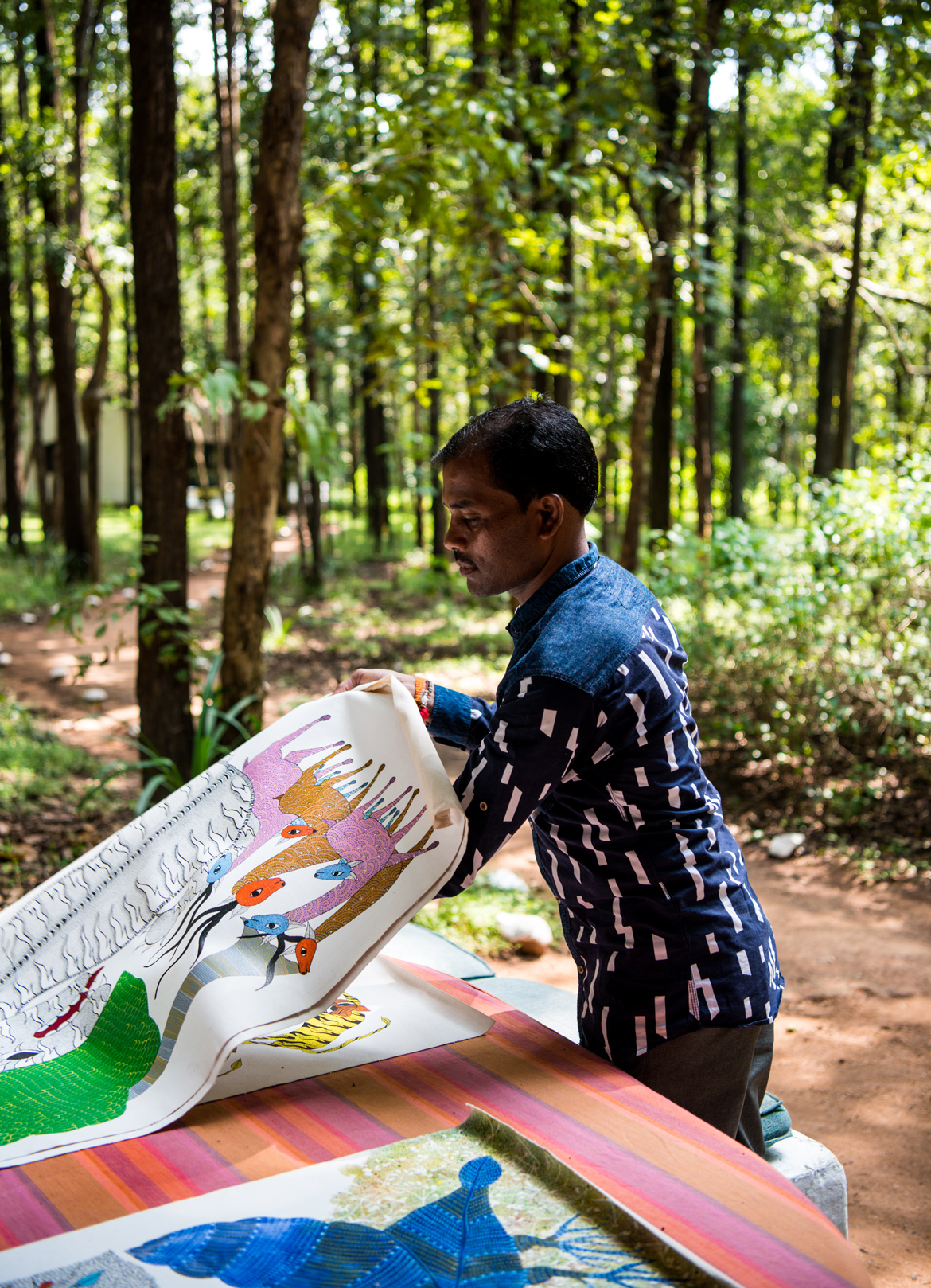 Ram Kumar Shyam, a Gond artist from Patangarh village displays his artwork.  