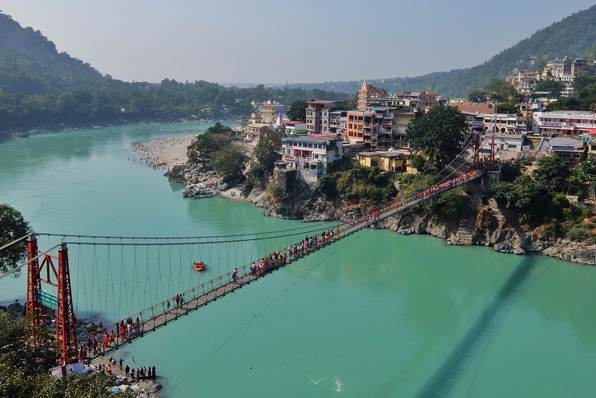 View of Ganga river and Lakshman Jhula bridge in Rishikesh