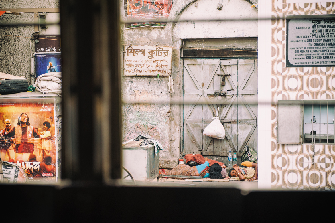 Glimpses of the city can be seen through the window