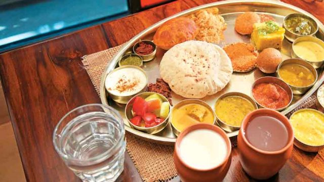 A varied combination of vegetables, lentils and breads make up a Rajasthani thali