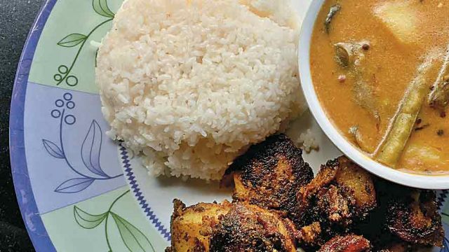 A simple and wholesome meal comprising kadhi, chawal and tuk