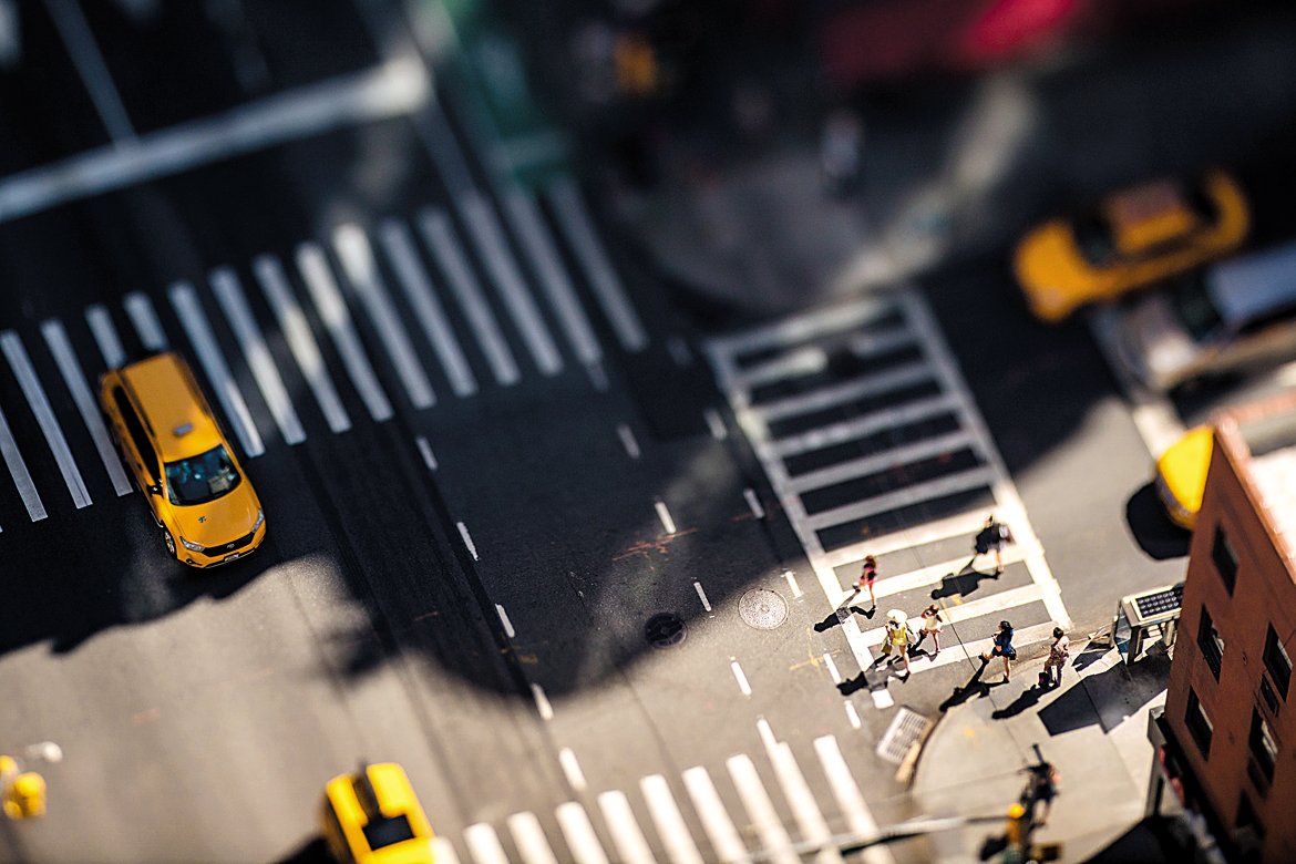 The famous yellow taxi cab at a Manhattan crossing