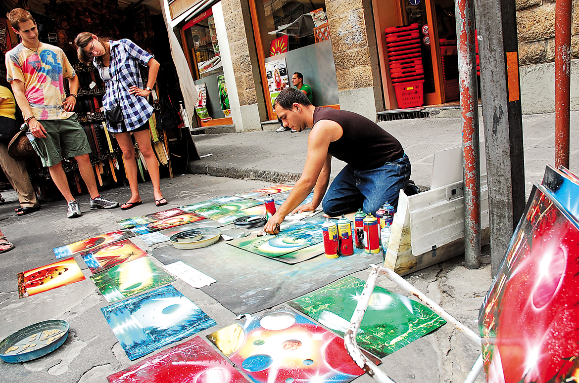 A street artist displays his collection