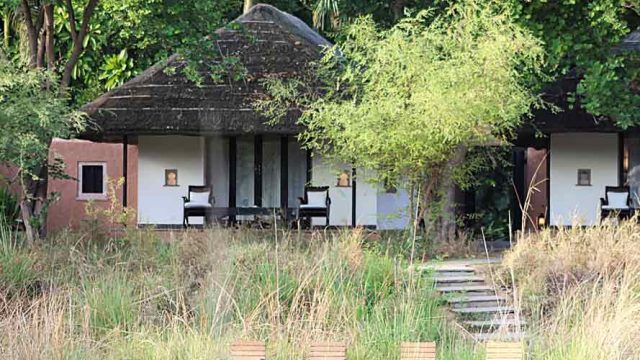 The cottages at Khem Villas stand surrounded by dense foliage