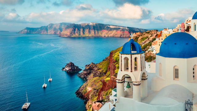 The famous blue-domed, white washed houses in Santorini